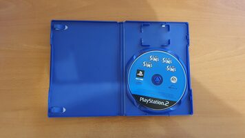 PS2 plateada + 6 juegos