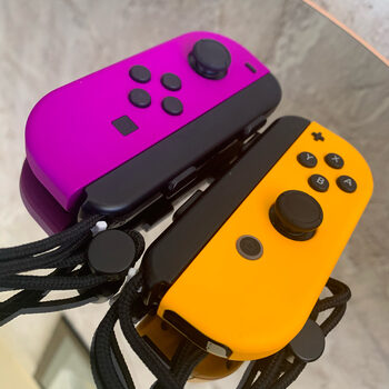 Nintendo Switch V2: Animal Crossing nugarele, purple & orange joycons