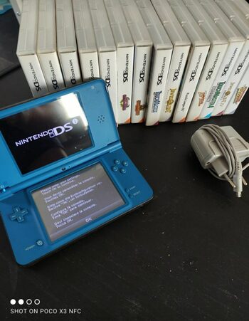 NINTENDO DSI XL WITH CHARGER AND A LOT OF GAMES!