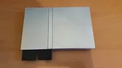 PS2 plateada + 6 juegos